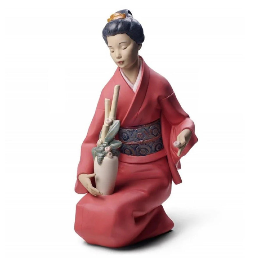 Scultura in porcellana spagnola "DECORANDO IL MAZZO DI FIORI" Nao by Lladrò